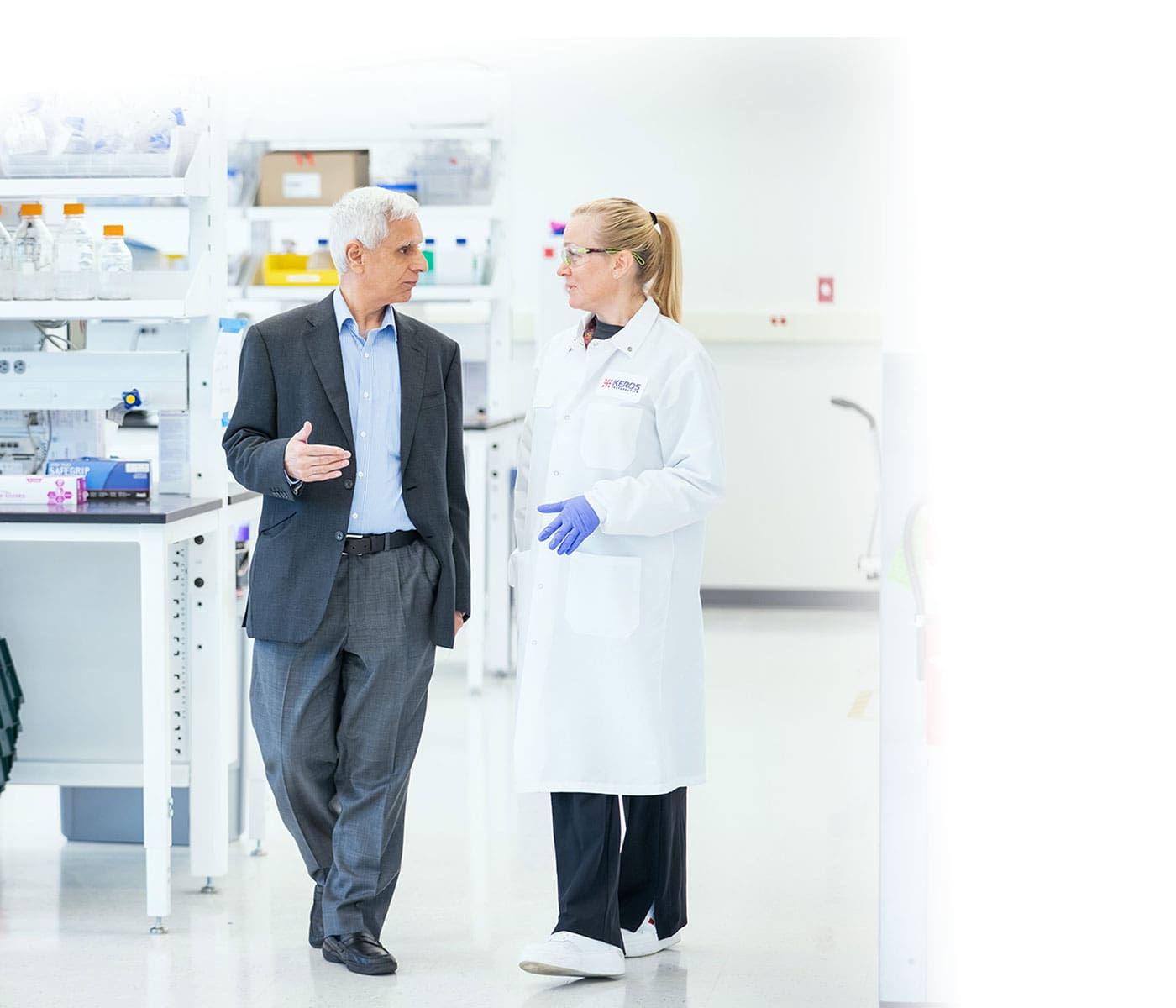 Keros Therapeutics CEWO walking through a lab having a discussion with a female scientist